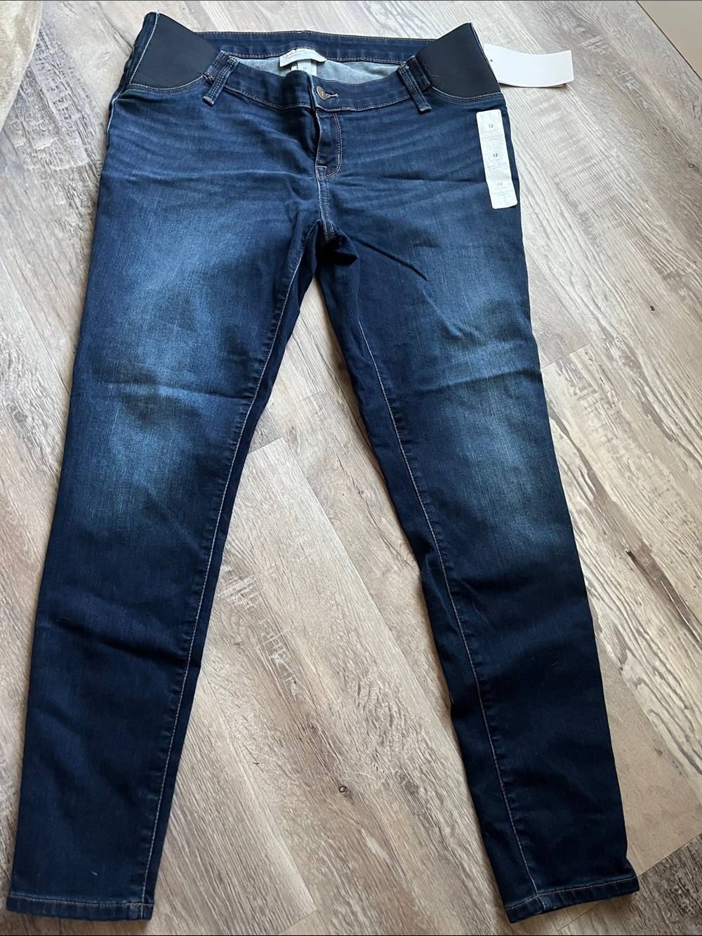 Dark blue maternity jeans with under the belly grow with you waistband!